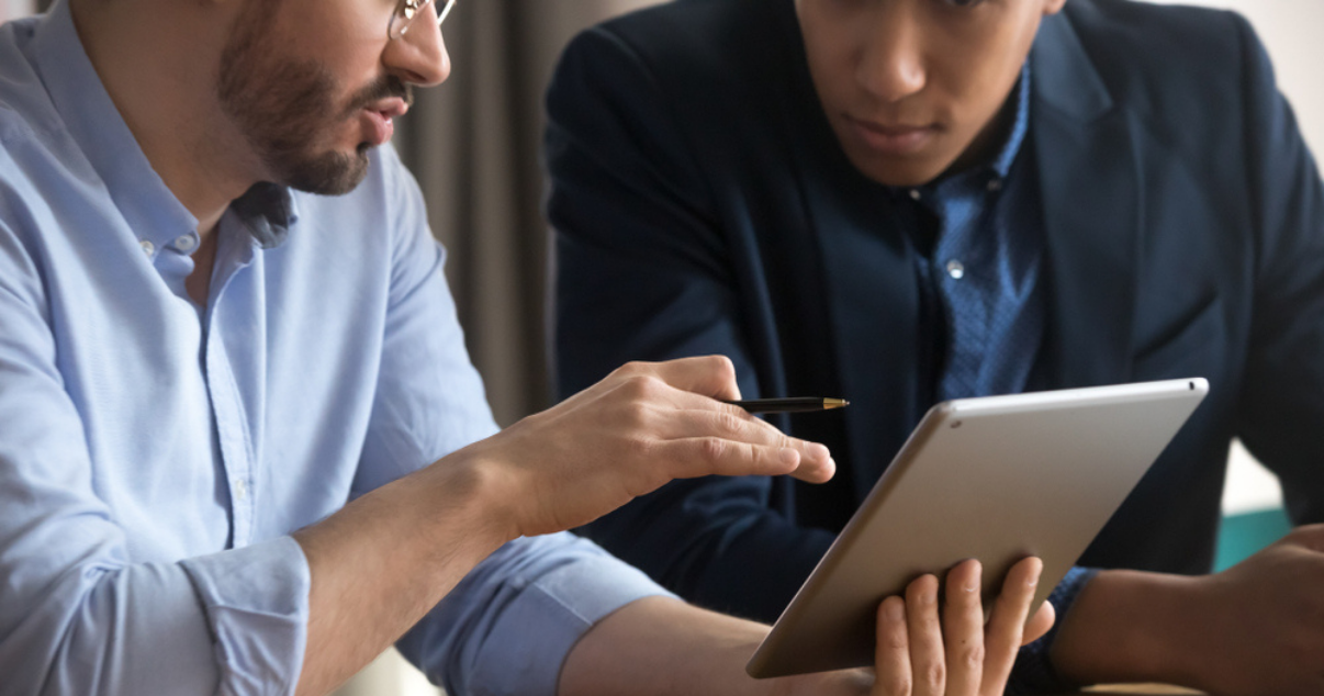 Co-workers learning more about subscription business models